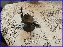 Rare Bronze Aladdin oil, genie lamp 7 inches long 5 inches high