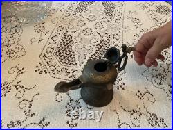 Rare Bronze Aladdin oil, genie lamp 7 inches long 5 inches high